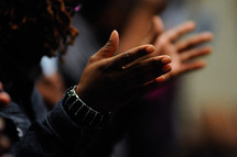 hands in worship at church 