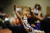 Raised hands during a worship service.