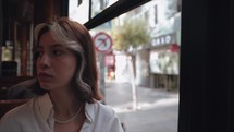 Thoughtful girl riding on a bus in Istanbul