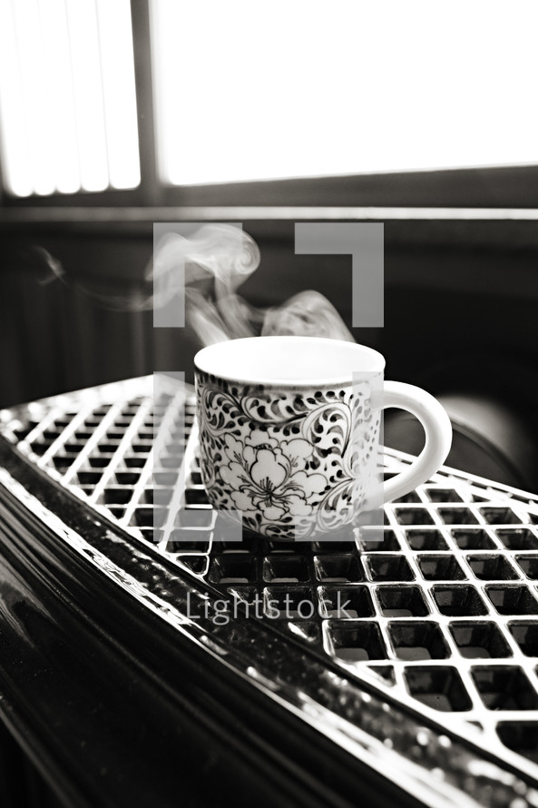 Mug of hot coffee steam cup