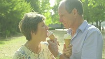 senior caucasian couple eating ice cream 