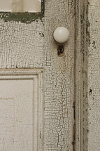 crackling white paint on an old door 