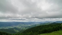 Clouds motion over green Carpathian mountains country in summer nature time lapse
