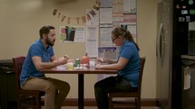 employees eating in a break room 