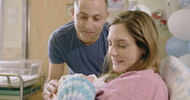 Mother and father with a newborn baby at the hospital