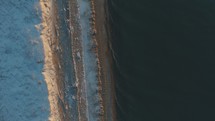 aerial view over a winter shoreline 