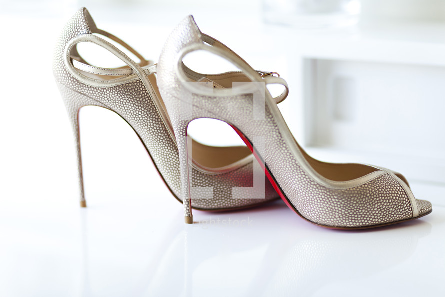 A pair of high heeled shoes wedding stiletto expensive Louis Vuitton 