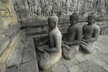 Line of statues of Buddha at Borobdur, Indonesia 