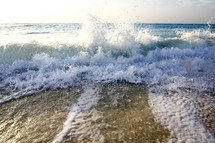 waves crashing on the shore 