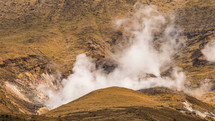 Hot volcanic smoke cloud from crater of volcano mountains in New Zealand Tongariro Park Time-lapse
