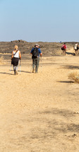 people exploring a desert 