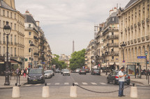 busy streets in Paris and concrete barriers 
