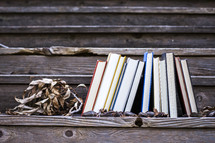 row of books on wood steps 