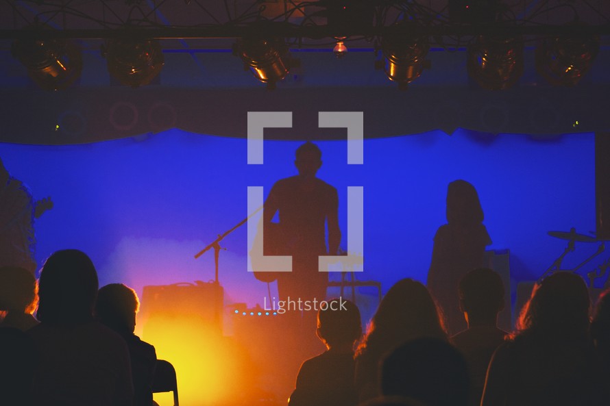 silhouette of a musician on stage