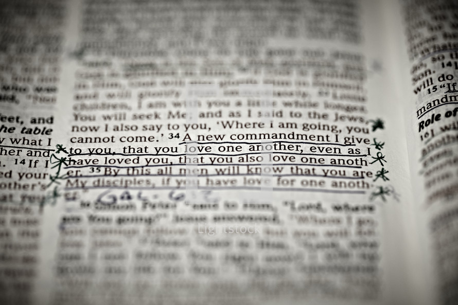A closeup of the scripture verse John 13:34