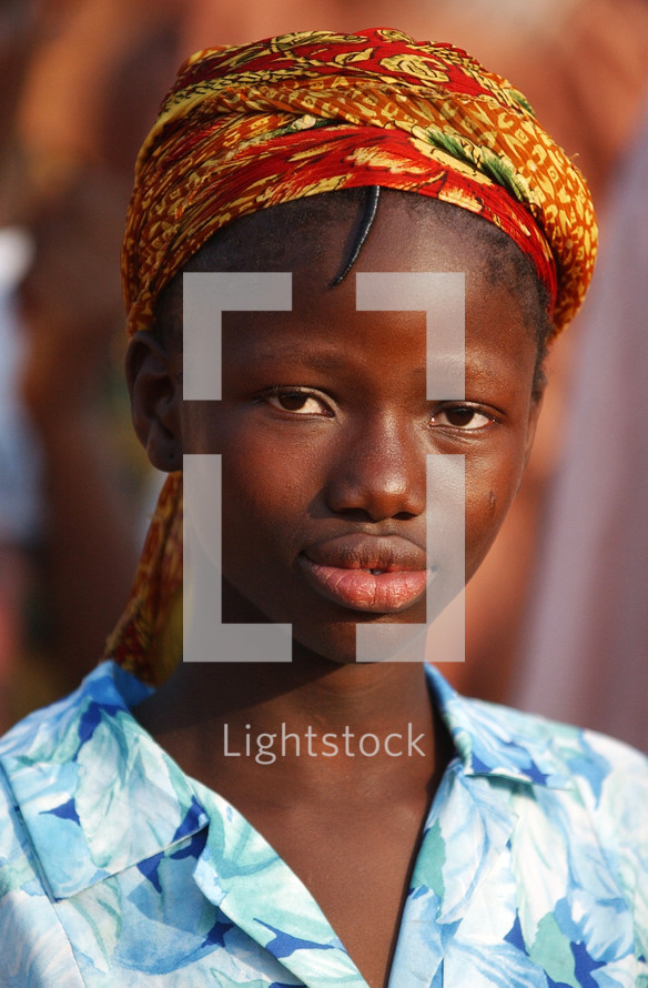 African girl in local traditional headdress {Try search for Ethnic Faces}