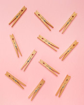 clothespins on a pink background 