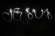 word JESUS written with sparklers