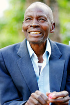 smiling african man in a blazer, uganda africa missions