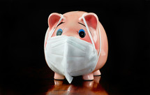 piggy bank with a surgical mask 