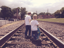 little boys on the tracks