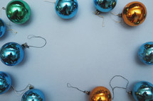 our old vintage ornaments forming a border on blue