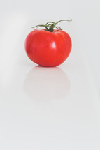 a red tomato on a white background 