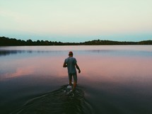a man walking in a lake 