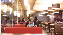man eating alone in a diner 