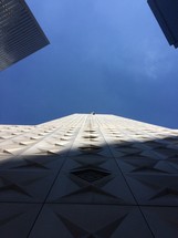 looking up at the sky between buildings 