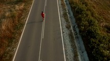 a man jogging on a road 