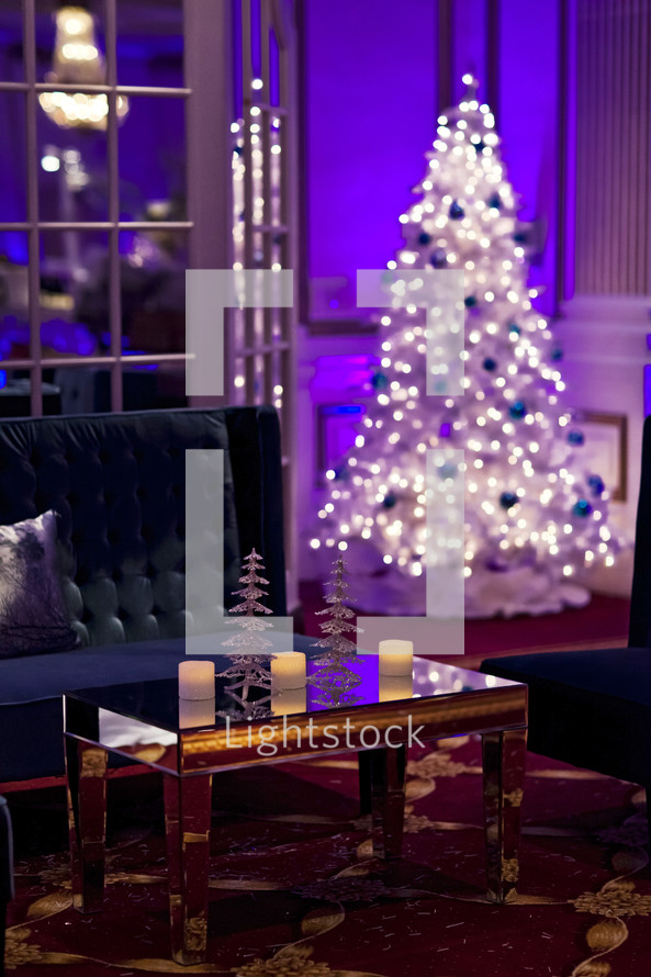 holiday christmas lounge area lights on a white Christmas tree