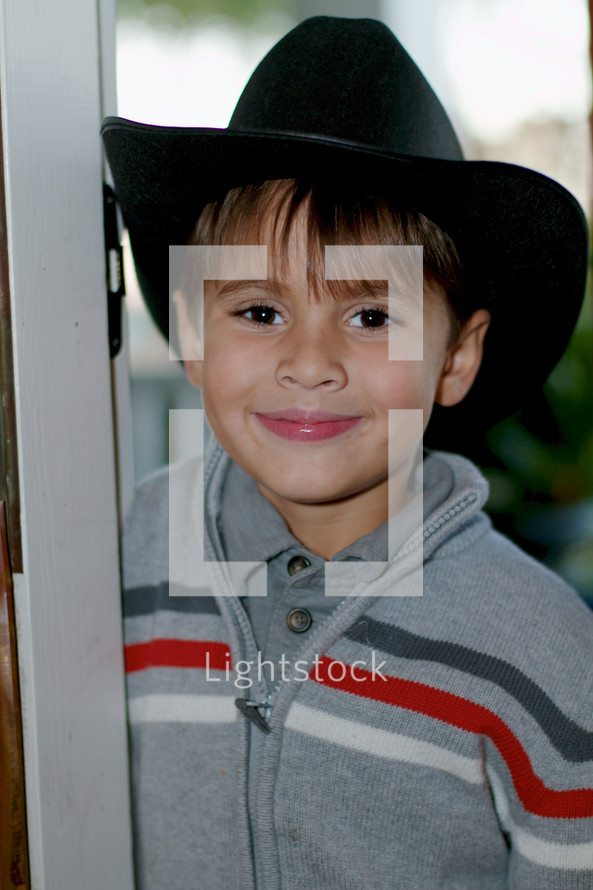 boy child wearing a cowboy hat