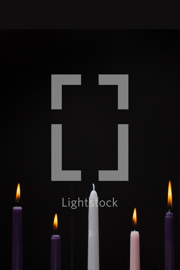 advent candles on a black background 