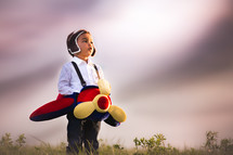 a toddler in an airplane costume 