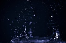 A splashing water drop isolated on black