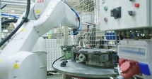 Robot working in a production line of parts for the automotive industry