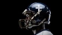Team Jesus. Close-up of a Black American Football Player with a cross on his helmet