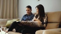Man and woman doing bible study in home
