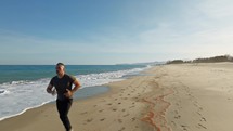 Determined Man Runs On The Beach To Achieve His Goals