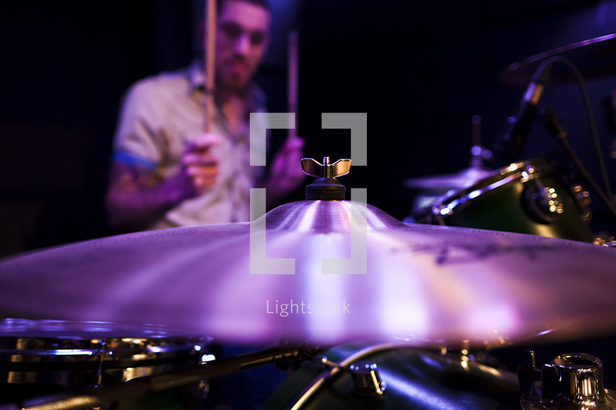 A drummer and a cymbal drum kit worship