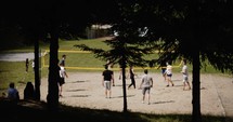 people playing beach volleyball 