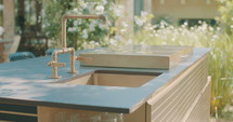 Tracking shot of an outdoor luxury kitchen in a backyard