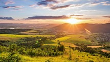 Beautiful Sunset in fresh green countryside landscape in summer evening in Carpathian Mountains nature Time lapse Day to Night
