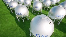 Big gas station spheres on green grass clean energy
