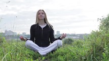 Yoga exercises outdoors Meditating