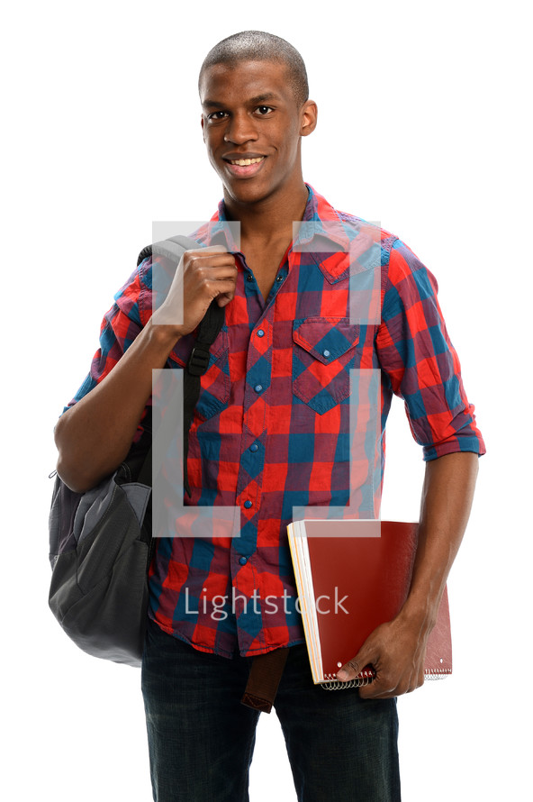 college student holding his back pack and notebook 