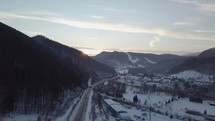 Aerial view of sunset over high way in winter
