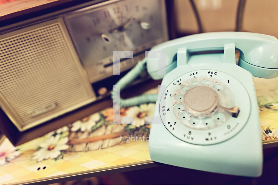 Rotary telephone and vintage radio