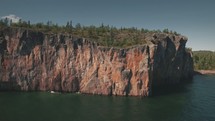 drone over cliffs and water 
